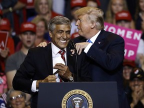 In this Aug. 2, 2018, photo, President Donald Trump, right, greets Senate candidate Rep. Lou Barletta, R-Pa., during a rally in Wilkes-Barre, Pa. More than 2,600 candidates are running in the midterm elections. But for the president, the election comes down to one person: Donald Trump. With the primary calendar winding down, Trump's me-first strategy is prompting a wave of concern within his own party.