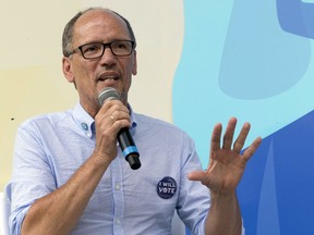 FILE - In this July 21, 2018, file photo, Democratic National Committee Chair Tom Perez speak in New York. Democrats seem eager to highlight Republican corruption ahead of the November midterm elections now that two of President Donald Trump's former top allies are felons. As the party faithful gathered in Chicago Aug. 22 for the Democratic National Committee's summer meeting, Perez ticked off the growing list of legal troubles for Trump and other Republicans. An "out of control" situation, he said, demands that voters "put up guard rails" by returning Democrats to power.
