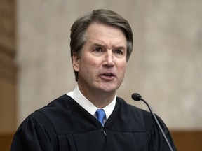 In this Aug. 7, 2018, photo, President Donald Trump's Supreme Court nominee, Judge Brett Kavanaugh, officiates at the swearing-in of Judge Britt Grant to take a seat on the U.S. Court of Appeals for the Eleventh Circuit at the U.S. District Courthouse in Washington. Kavanaugh has expressed concern about federal agencies running amok. But his view that they should adhere strictly to laws passed by Congress worries liberals.