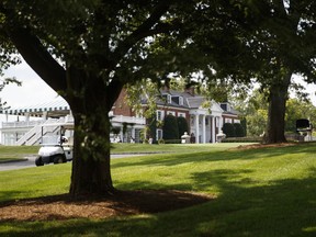 The clubhouse of Trump National Golf Club is seen from the media van, Thursday, Aug. 9, 2018, Bedminster, N.J., before a President Donald Trump meets with state leaders about prison reform.