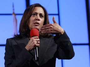 FILE - In this April 5, 2018, file photo, Sen. Kamala Harris, D-Calif., speaks at a a town hall meeting in Sacramento, Calif. Corporate donations have emerged as a new litmus test for Democratic candidates. In ads, stump speeches and debates, scores of politicians are pledging to reject corporate PAC donations. But the pledge may be more symbolic than financial. "Money has now really tipped the balance between an individual having equal power in an election to a corporation," Harris said on "The Breakfast Club," a program on a New York hip hop and R&B radio station.