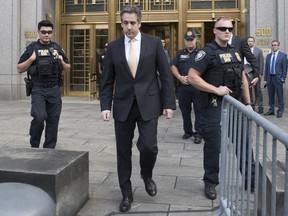 In this Aug. 21, 2018, photo, Michael Cohen, center, leaves federal court in New York. President Donald Trump has long demanded loyalty from his friends and associates. But he has been learning the hard way that in politics those relationships come and go. A key defection came this week when Cohen, Trump's former personal attorney, implicated the president in a stunning plea deal, followed by a longtime friend and media boss cooperating with prosecutors.