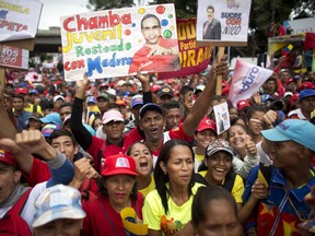 Supporters of Venezuela's President Nicolas Maduro rally in Caracas, Venezuela, Monday, Aug. 13, 2018. The United Socialist Party of Venezuela (PSUV) organized the rally to show support for the president following what the government called a failed assassination attempt with explosives-laden drones.