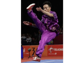 China's Peiyuan Sun perform during the Wushu men's Changquan games at the 18th Asian Games in Jakarta, Indonesia on Sunday, Aug. 19, 2018. Sun won gold.