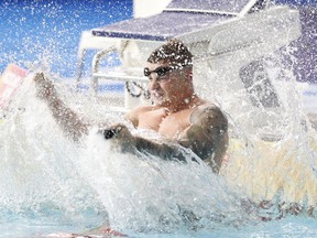 Adam Peaty of Great Britain reacts after winning the 100 meters breaststroke men final setting a new world record at the European Swimming Championships in Glasgow, Scotland, Saturday, Aug. 4, 2018.