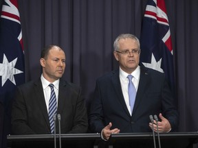 Australia's next Prime Minister Scott Morrison, right, and Deputy Leader of the Liberal Party Josh Frydenberg hold their press conference at Parliament House in Canberra, Friday, Aug. 24, 2018. Australia government lawmakers on Friday elected Treasurer Morrison as the next prime minister in a ballot that continues an era of extraordinary political instability.