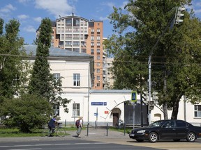 This Tuesday, July 31, 2018 photo shows the entrance of the building of the Russian military intelligence service, named in Robert Mueller's July 13 indictment, as home to GRU Unit 26165 in Moscow, Russia. The leak of an alleged Russian hacker's conversations with a security researcher shows more about the shadowy group of 12 Russian spies indicted by the FBI last month for targeting the 2016 U.S. election.