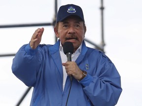 Nicaragua's President Daniel Ortega speaks to supporters in Managua, Nicaragua, Wednesday, Aug. 29, 2018. A United Nations report released Wednesday calls on Ortega's government to immediately halt the persecution of protesters and disarm the masked civilians who have been responsible for much of the killings and arbitrary detentions. Ortega's government dismissed the report as baseless. It denied accusations of excessive use of force against protesters.