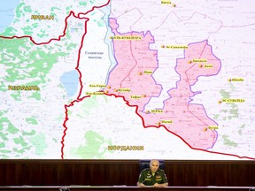 Col.-Gen. Sergei Rudskoy of the Russian Military General Staff speaks to the media as a screen shows the map of Israel, Jordan, Syria and Li bacon including Israeli-occupied Golan Heights in Syria in Moscow, Russia, Thursday, Aug. 2, 2018. Russia says UN peacekeepers return to frontier between Syria, Israeli-occupied Golan Heights for first time in years.