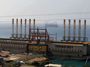 This July 16, 2018 photo, shows the Karadeniz Powership Orhan Bey, foreground, and a second floating power station off the coast at Jiyeh, south of Beirut, Lebanon. It was supposed to be a goodwill gesture from an energy company in Turkey. This summer, the Karadeniz Energy Group lent Lebanon a floating power station to generate electricity at below-market rates to help ease the strain on the country's woefully undermaintained power sector. Instead, the barge's arrival opened a pandora's box of partisan mudslinging in a country hobbled by political sectarianism and dysfunction.