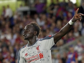 Liverpool's Sadio Mane celebrates after scoring his side's second goal during the English Premier League soccer match between Crystal Palace and Liverpool at Selhurst Park stadium in London, Monday, Aug. 20, 2018.