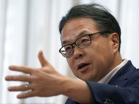 Japan's Trade Minister Hiroshige Seko speaks during an exclusive interview with The Associated Press at his office in Tokyo Thursday, Aug. 23, 2018. Seko criticized President Donald Trump's tariff policies as based on a serious misunderstanding about the importance of free trade and the contributions of Japanese companies to the U.S. economy.