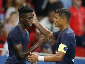 PSG's Thiago Silva, right, and PSG's Timothy Weah celebrate victory in their League One soccer match between Paris Saint-Germain and Caen at Parc des Princes stadium in Paris, Sunday, Aug. 12, 2018.