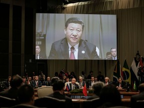 China's President Xi Jinping speaks during the Open Session of the 10th BRICS summit (acronym for the grouping of the world's leading emerging economies, namely Brazil, Russia, India, China and South Africa) on July 26, 2018 at the Sandton Convention Centre in Johannesburg, South Africa. It is not enough for Xi that he's often called China's "Paramount Leader" and that the Chinese Communist Party officially gave him the title of "Core Leader." He wants to lift the world's opinion of China and what he calls the "Chinese Dream."