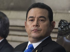 FILE - This Jan. 14, 2018 file photo shows Guatemala's President Jimmy Morales at his second annual State of the Nation, in Guatemala City. The office of Attorney General and the United Nations International Commission Against Impunity are asking the Guatemalan Supreme Court to withdraw Morales' immunity from prosecution to investigate him on allegations of illicit election campaign financing by his party.