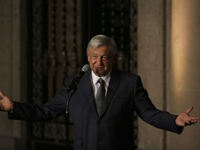 FILE - In this  Aug. 9, 2018 file photo, Mexico's President-elect Andres Manuel Lopez Obrador speaks to reporters after meeting with Mexico's President Enrique Pena Nieto at the National Palace in Mexico City. Lopez Obrador has thanked U.S. President Donald Trump on Friday, Aug. 25, for treating Mexicans with more respect, or at least not saying anything insulting lately.