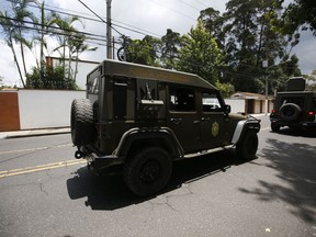 An armed army vehicle patrols in front of the United Nations International Commission Against Impunity, CICIG, headquarters in Guatemala City, Friday, Aug. 31, 2018. Guatemala president Jimmy Morales says he is not renewing mandate of U.N.-sponsored commission investigating corruption in the country.