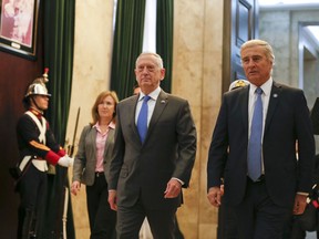 U.S. Secretary of Defense Jim Mattis, left, and Argentina's Defense Minister Oscar Raul Aguad arrive for a press conference in Buenos Aires, Argentina Wednesday, Aug. 15, 2018. Mattis is on an official visit to several South American countries.