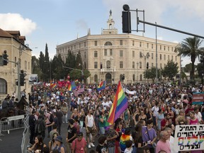 Participants wave LGBT pride rainbow flags during annual Gay Pride parade in Jerusalem, Thursday, Aug. 2, 2018.