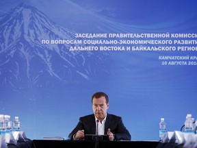 Russian Prime Minister Dmitry Medvedev speaks during a meeting in Kamchatka Peninsula region, Russian Far East, Russia, Friday, Aug. 10, 2018. Russia's prime minister sternly warned the United States on Friday against ramping up sanctions, saying that Moscow will retaliate with economic, political and unspecified "other" means.