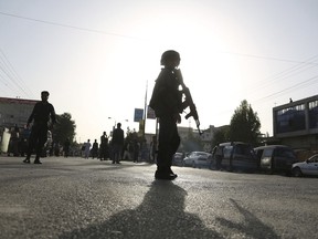 Security personnel arrived at the site of a deadly suicide bombing that targeted a training class in a private building in the Shiite neighbourhood of Dasht-i Barcha, in western Kabul, Afghanistan, Wednesday, Aug. 15, 2018. Both the resurgent Taliban and an Islamic State affiliate in Afghanistan have targeted Shiites in the past, considering them to be heretics.