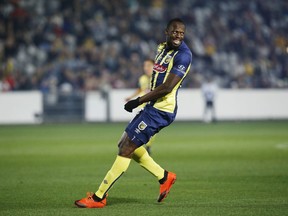 Usain Bolt overruns across the pitch during a friendly trial match between the Central Coast Mariners and the Central Coast Select in Gosford, Australia, Friday, Aug. 31, 2018. Bolt, who holds the world records for the 100- and 200-meter sprints and is an eight-time Olympic gold medalist, is hoping to earn a contract with the Mariners for the 2018-19 season in Australia's top-flight competition.