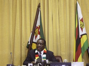 Zimbabwean President Emmerson Mnangagwa addresses the media at his offices in Harare, Wednesday, Aug, 29, 2018. Mnangagwa has set up a commission of inquiry into the killing of six people following military intervention in the capital two days after election.