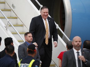 U.S. Secretary of State Michael Pompeo smiles as he arrives at the Subang military airport in Subang, Malaysia, Thursday, Aug. 2, 2018. Pompeo will meet senior Malaysian officials to discuss strengthening the Comprehensive Partnership and advancing common security and economic interests.