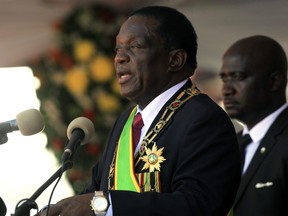 Zimbabwean President Emmerson Mnangagwa delivers his speech during his inauguration ceremony at the National Sports Stadium in Harare, Sunday, Aug. 26, 2018.