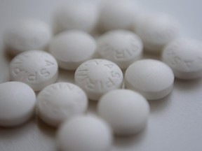 This Thursday, Aug. 23, 2018 photo shows an arrangement of aspirin pills in New York.