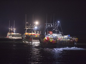 Lobster boats head to drop their traps from Digby, N.S. on Saturday, Oct. 14, 2017.