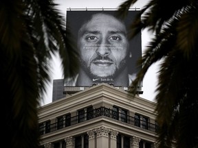 A billboard featuring former San Francisco 49ers quarterback Colin Kaepernick is displayed on the roof of the Nike Store on September 5, 2018 in San Francisco, California.