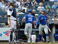 Randal Grichuk of the Toronto Blue Jays celebrates his second inning home run with teammate Kevin Pillar as Gary Sanchez of the Yankees looks on during their game Saturday at Yankee Stadium in New York.