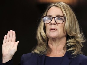 Professor Christine Blasey Ford, who accused U.S. Supreme Court nominee Brett Kavanaugh of a sexual assault in 1982, is sworn in to testify before a Senate Judiciary Committee confirmation hearing for Kavanaugh on Capitol Hill September 27, 2018 in Washington, DC.