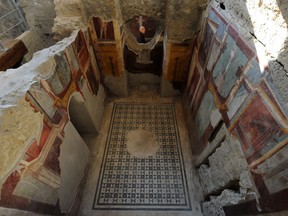 A picture shows frescoes in the Criptoporticus Domus, one of six restored domus at UN World Heritage Site Pompeii, on December 24, 2015 during the official opening to the public.