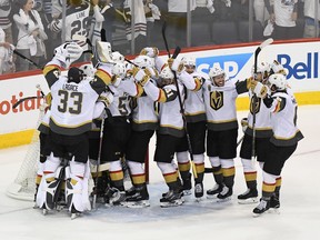 In this May 20 file photo, the Vegas Golden Knights celebrate their series-clinching victory over the Winnipeg Jets in the Western Conference final.