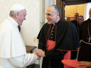 Pope Francis welcomes Cardinal Daniel DiNardo, leader the U.S. Conference of Bishops, prior to a private meeting with U.S. bishops and cardinals at the Vatican on Sept. 13, 2018.
