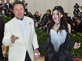 Elon Musk and Grimes arrive for the 2018 Met Gala on May 7, 2018, at the Metropolitan Museum of Art in New York.