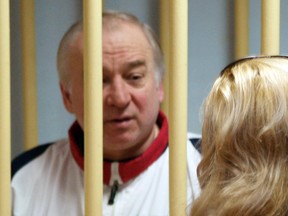 In this file photo taken on Aug. 09, 2006, former Russian military intelligence colonel Sergei Skripal attends a hearing at the Moscow District Military Court in Moscow. The man accused of poisoning Sergei Skripal grew up in a family with ties to the Russian army and signed up for officer training straight after school, according to neighbours from his home town near the Chinese border.
