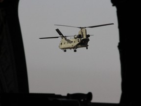 A U.S. Chinook military helicopter carrying U.S. Defence Secretary Jim Mattis flies towards NATO's Resolute Support mission in Kabul on September 7, 2018.