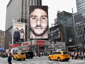 A Nike ad featuring Colin Kaepernick is displayed in New York City.