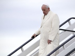 Pope Francis arrives at Riga airport, Latvia, Monday, Sept. 24, 2018. Francis is travelling to Lithuania, Latvia and Estonia to mark their 100th anniversaries of independence and to encourage the faith in the Baltics, which saw five decades of Soviet-imposed religious repression and state-sponsored atheism.