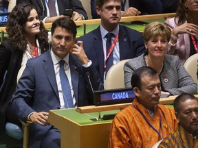 Canadian Prime Minister Justin Trudeau and International Development Minister Marie-Claude Bibeau listen to speakers at the Nelson Mandela Peace Summit opening ceremony at the United Nations Headquarters, Monday, Sept. 24, 2018.