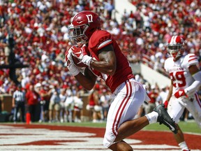 Alabama wide receiver Jaylen Waddle (17) catches a pass for a touchdown against Louisiana-Lafayette during the first half of an NCAA college football game, Saturday, Sept. 29, 2018, in Tuscaloosa, Ala.