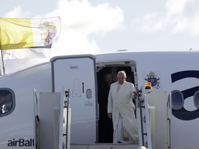 Pope Francis disembarks from a plane upon his arrival at Tallinn airport, Estonia, Tuesday, Sept. 25, 2018. Pope Francis concludes his four-day tour of the Baltics visiting Estonia.