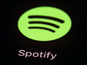 FILE- This March 20, 2018, file photo shows the Spotify app on an iPad in Baltimore. Music streaming sites Spotify and Deezer are among European tech companies and trade associations calling on EU officials to toughen proposed legislation aimed at combating unfair business practices by U.S. giants like Apple, Google and Amazon, it was reported on Tuesday, Sept. 25, 2018.