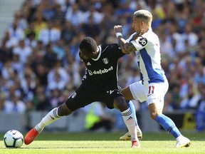 Fulham's Jean Michael Seri, left, vies for the ball with Brighton's Anthony Knockaert, during the English Premier League soccer match between Brighton and Fulham, at the AMEX Stadium, in Brighton, England, Saturday, Sept. 1, 2018.
