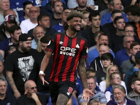 Huddersfield Town's Philip Billing celebrates scoring his side's first goal of the game  during the English Premier League soccer match between Everton and Huddersfield Town at Goodison Park, in Liverpool, England, Saturday, Sept. 1, 2018.