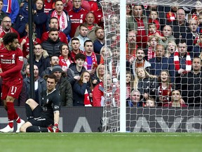 Liverpool's Mohamed Salah attempts a back heel near the Southampton goal, during the English Premier League soccer match between Liverpool and Southampton, at Anfield, in Liverpool, England, Saturday, Sept. 22, 2018.