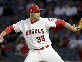 Los Angeles Angels relief pitcher Jim Johnson throws against the Texas Rangers during the first inning of a baseball game in Anaheim, Calif., Tuesday, Sept. 11, 2018.